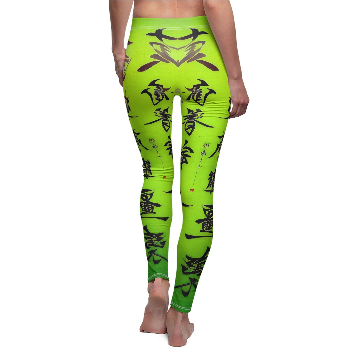 Back view of a model wearing a pair of lime green leggings with a white thread color and a graphic print featuring stylized Chinese lettering in black.