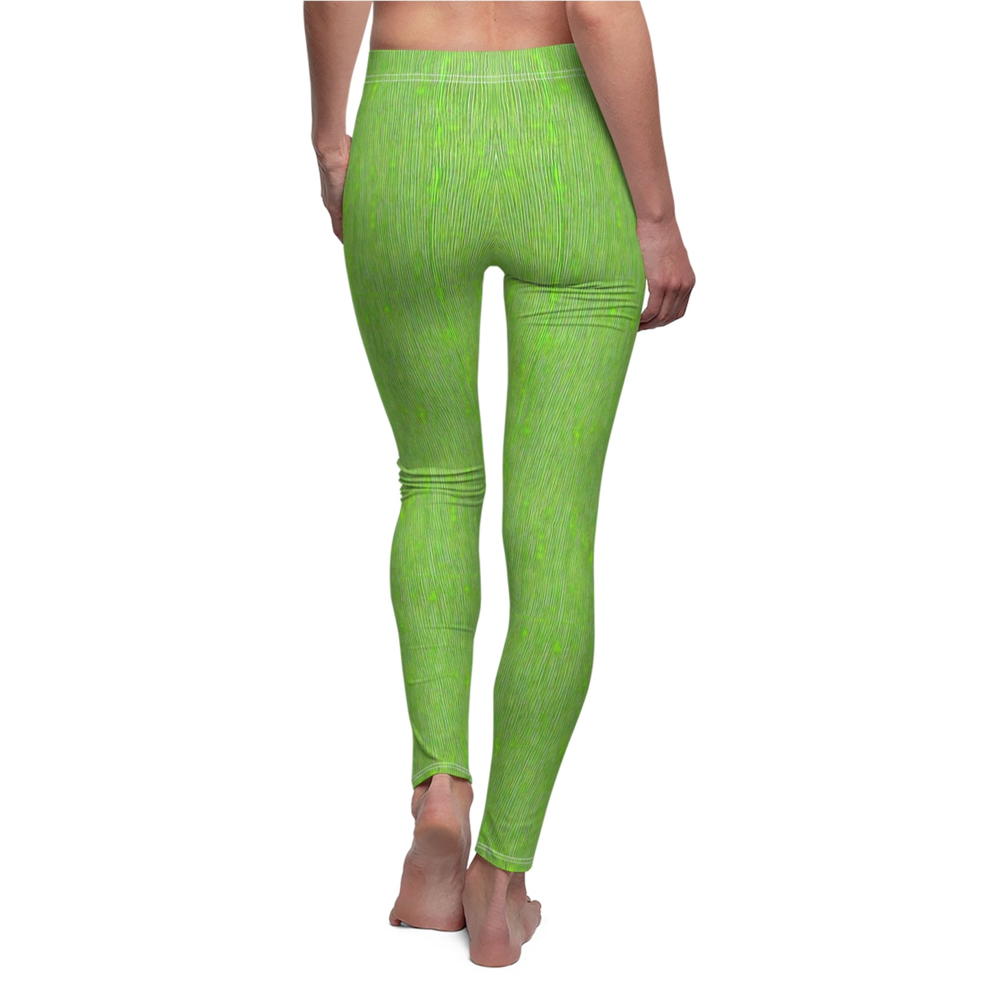 A pair of elastic skinny fit leggings in lime green with a white stripe pattern, worn by model, back view.