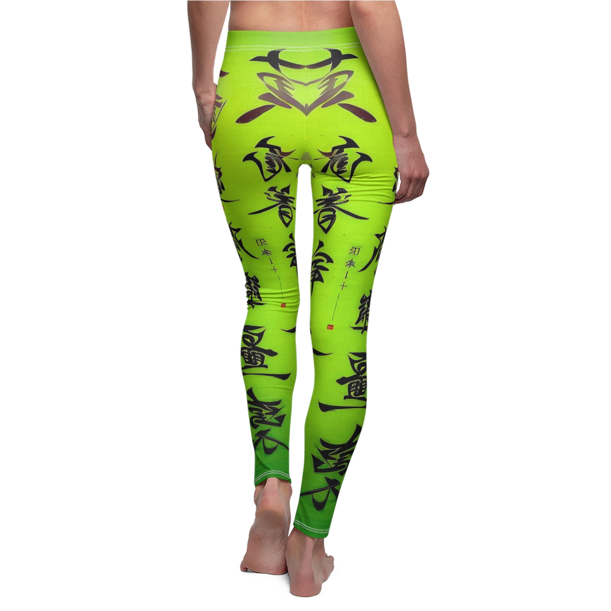 Back view of a model wearing a pair of lime green leggings with a white thread color and a graphic print featuring stylized Chinese lettering in black. 