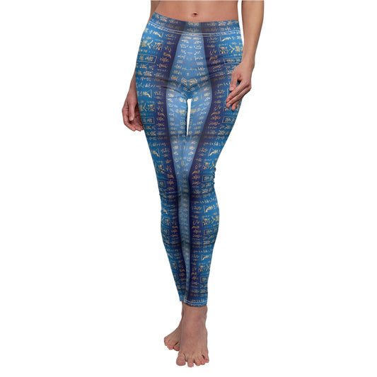 A pair of blue leggings worn by model, front view, covered in gold Chinese writing, showcasing the product's skinny fit and vibrant color.