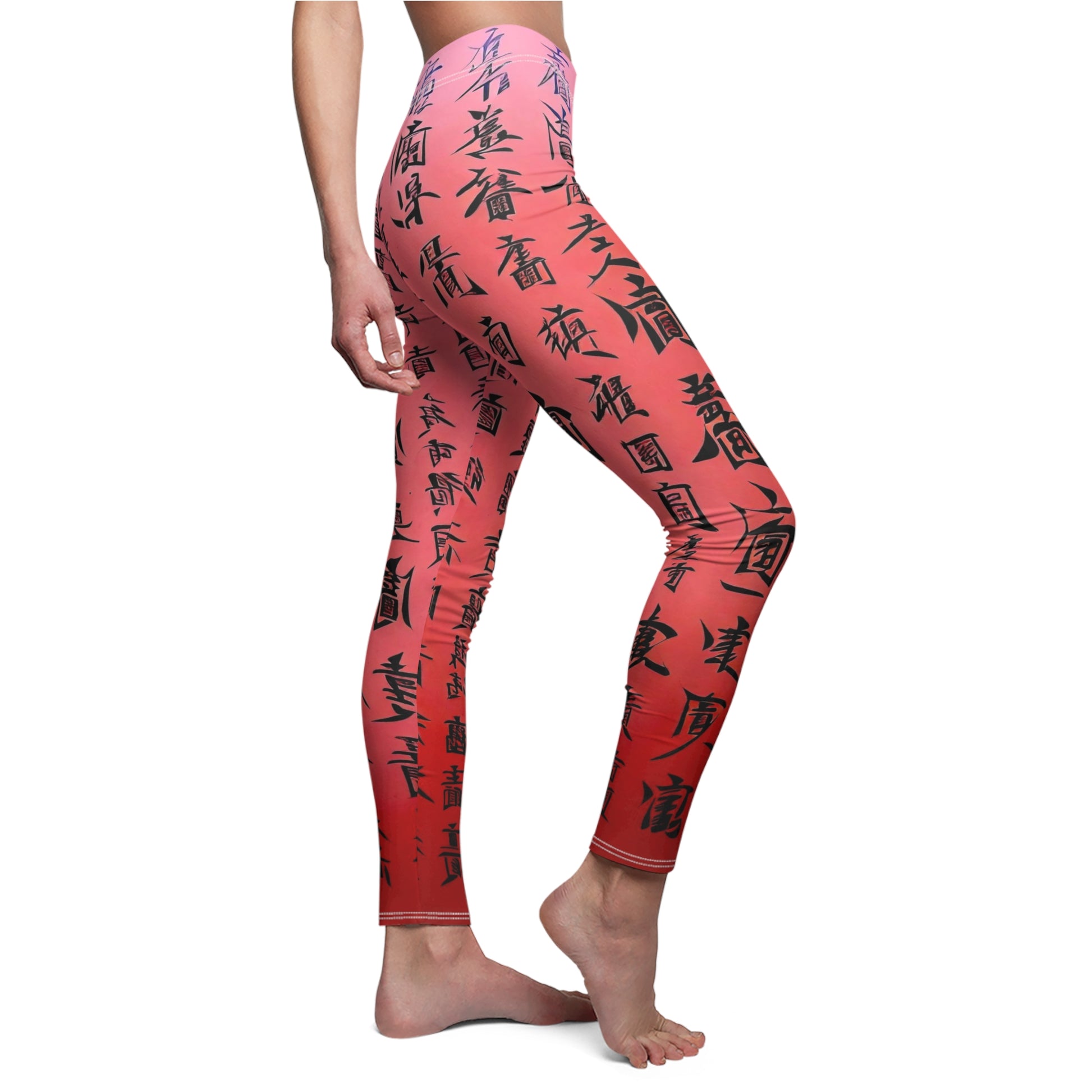 A pair of pink elastic skinny fit leggings with a black all-over print featuring what appears to be Chinese characters.