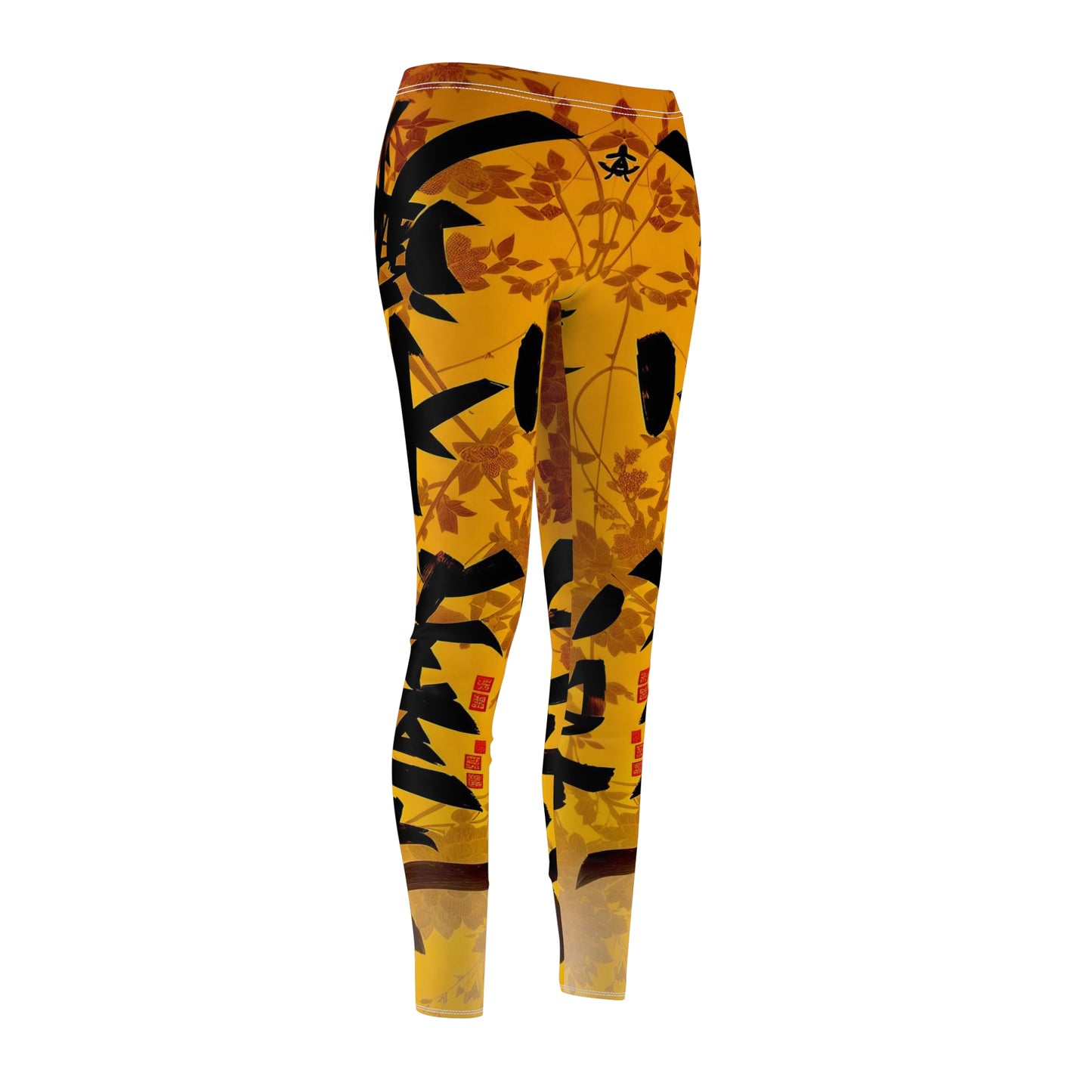 A pair of skinny fit leggings featuring a gold and orange color scheme with an Oriental geometric floral pattern, front side view.