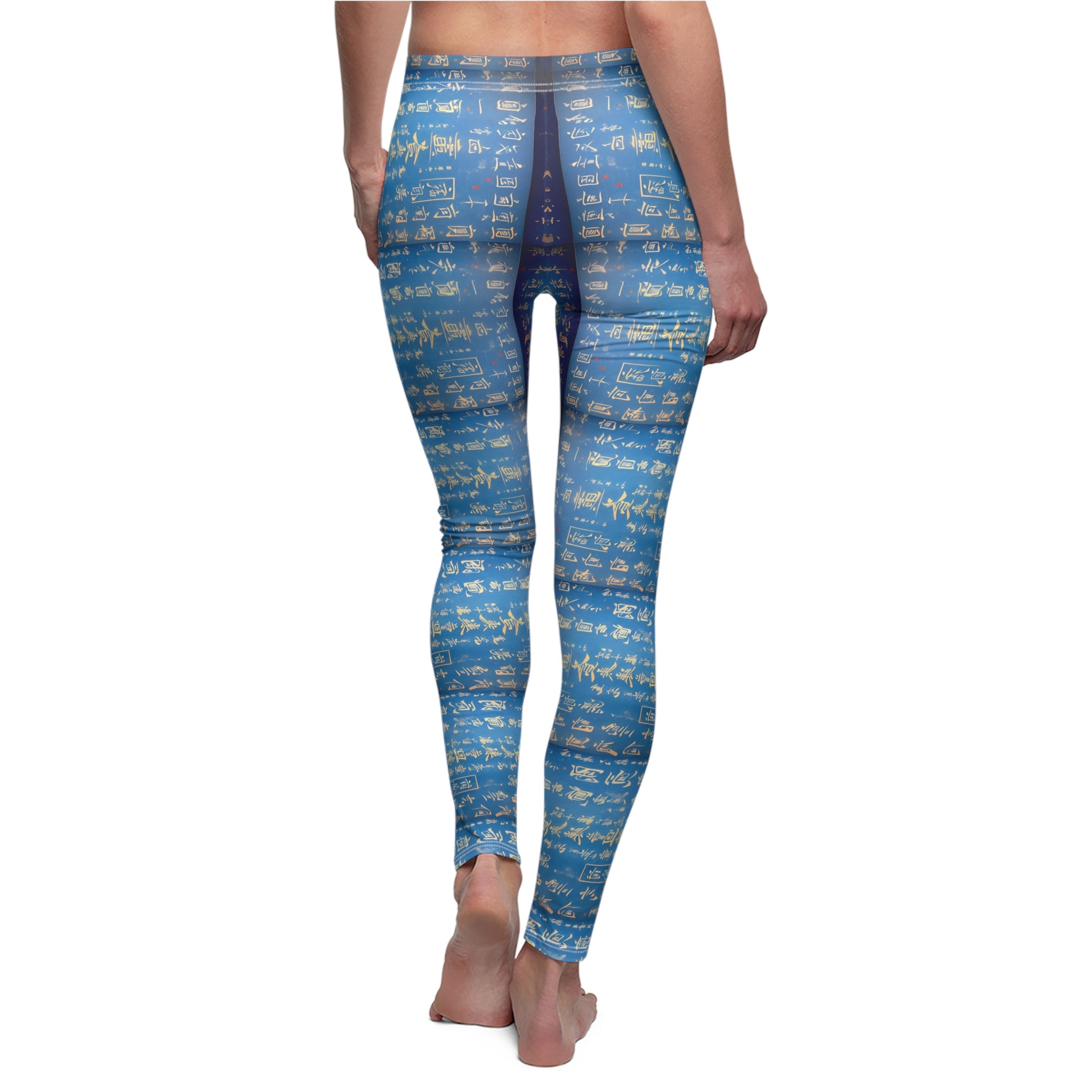 A pair of blue leggings worn by model, back view, covered in gold Chinese writing, showcasing the product's skinny fit and vibrant color.