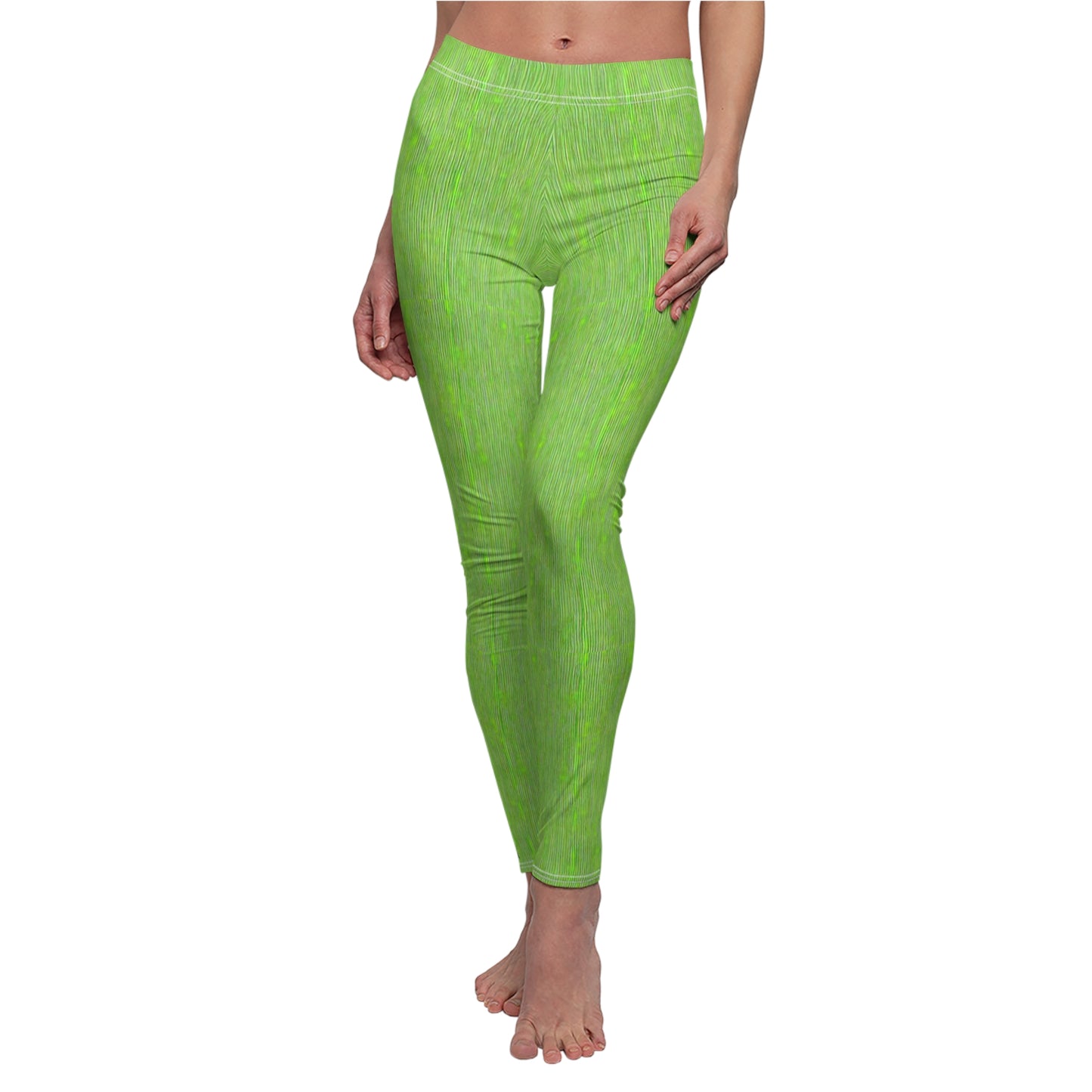 A pair of elastic skinny fit leggings in lime green with a white stripe pattern, worn by a model.
