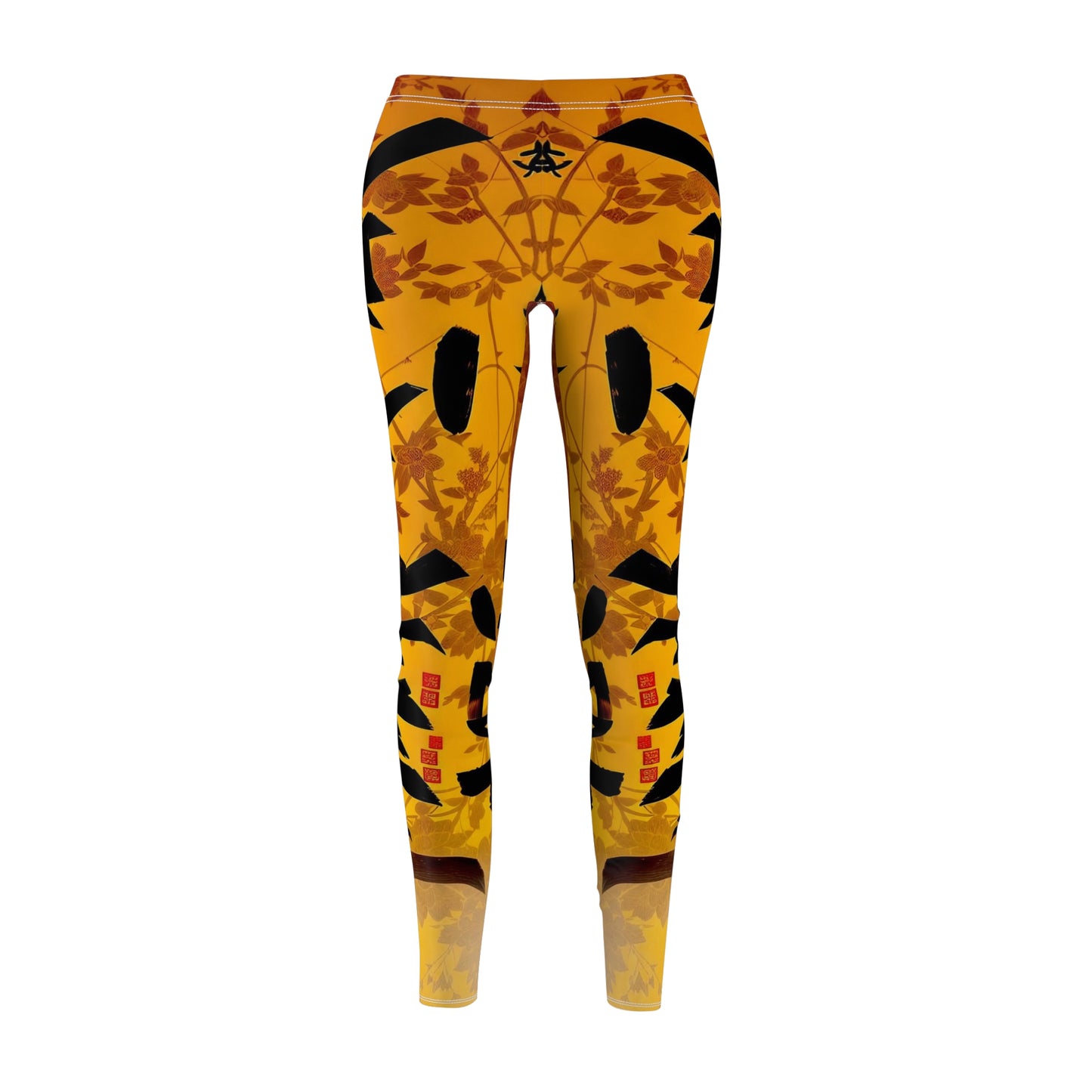 A pair of skinny fit leggings featuring a gold and orange color scheme with an Oriental geometric floral pattern, front view.