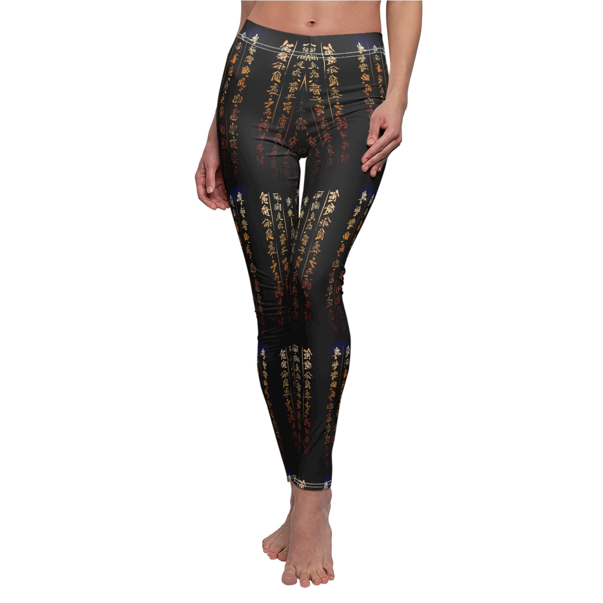 A model wearing a pair of black activewear leggings with a gold all-over Chinese calligraphy print, featuring a skinny fit design.