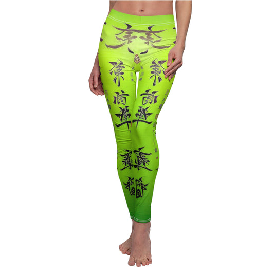 Front view of model wearing a pair of lime green leggings with a white thread color and a graphic print featuring stylized Chinese lettering in black. 