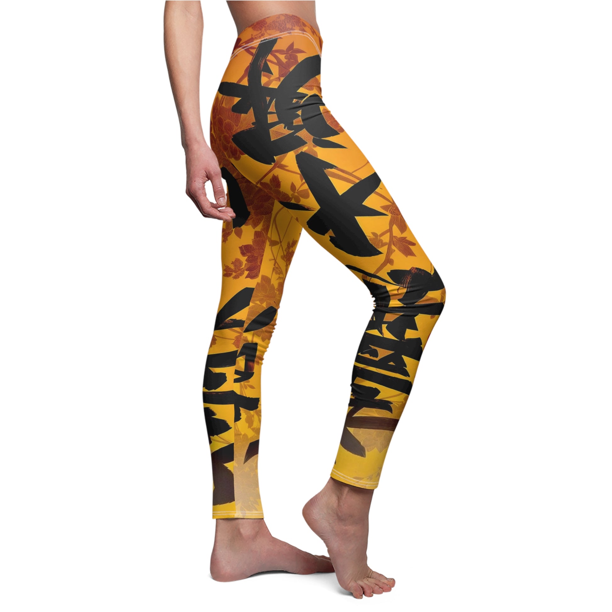 A pair of skinny fit leggings featuring a gold and orange color scheme with an Oriental geometric floral pattern, side view, worn by model.