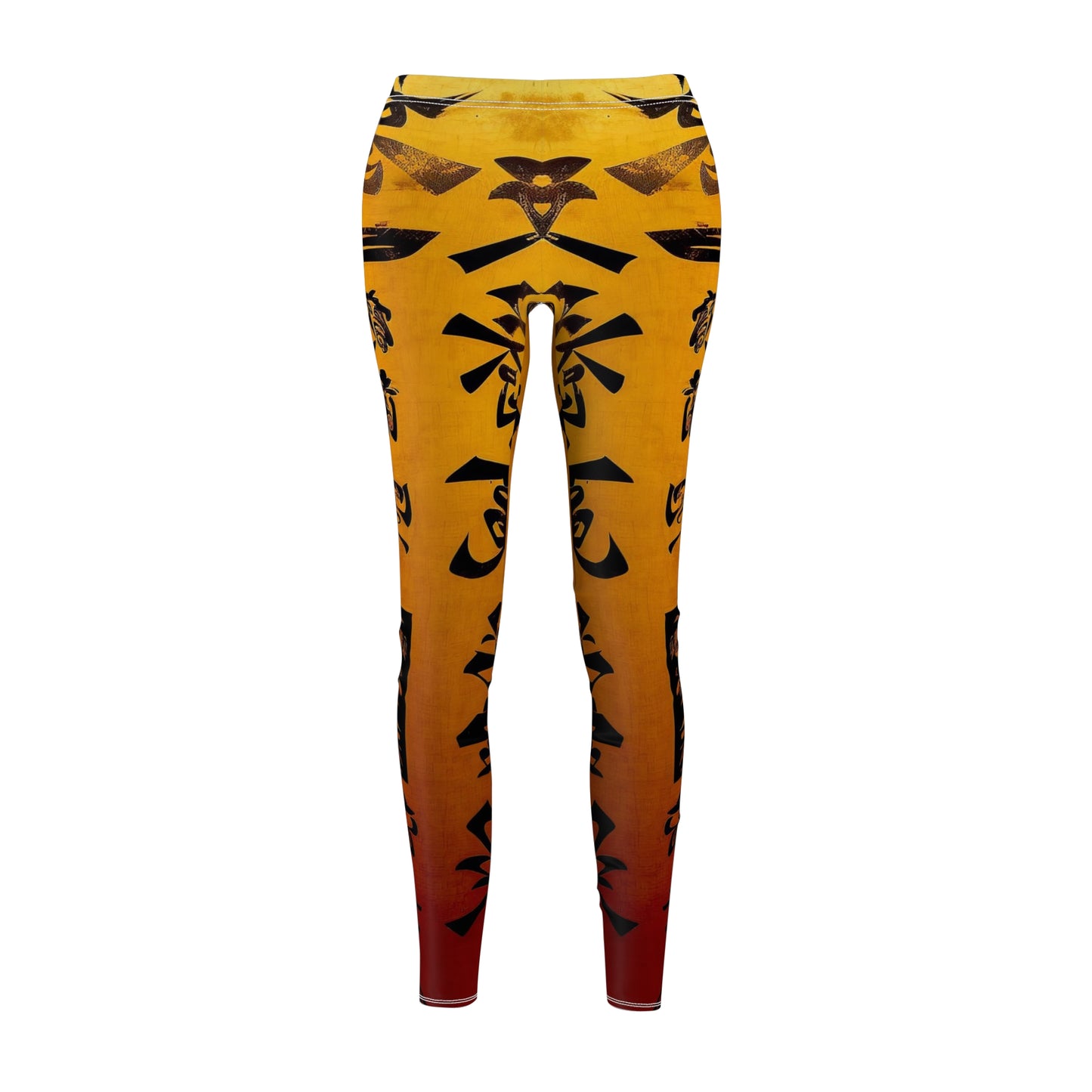 Front view of a pair of skinny fit leggings featuring a gold color with black geometric patterns and a visible white thread color.