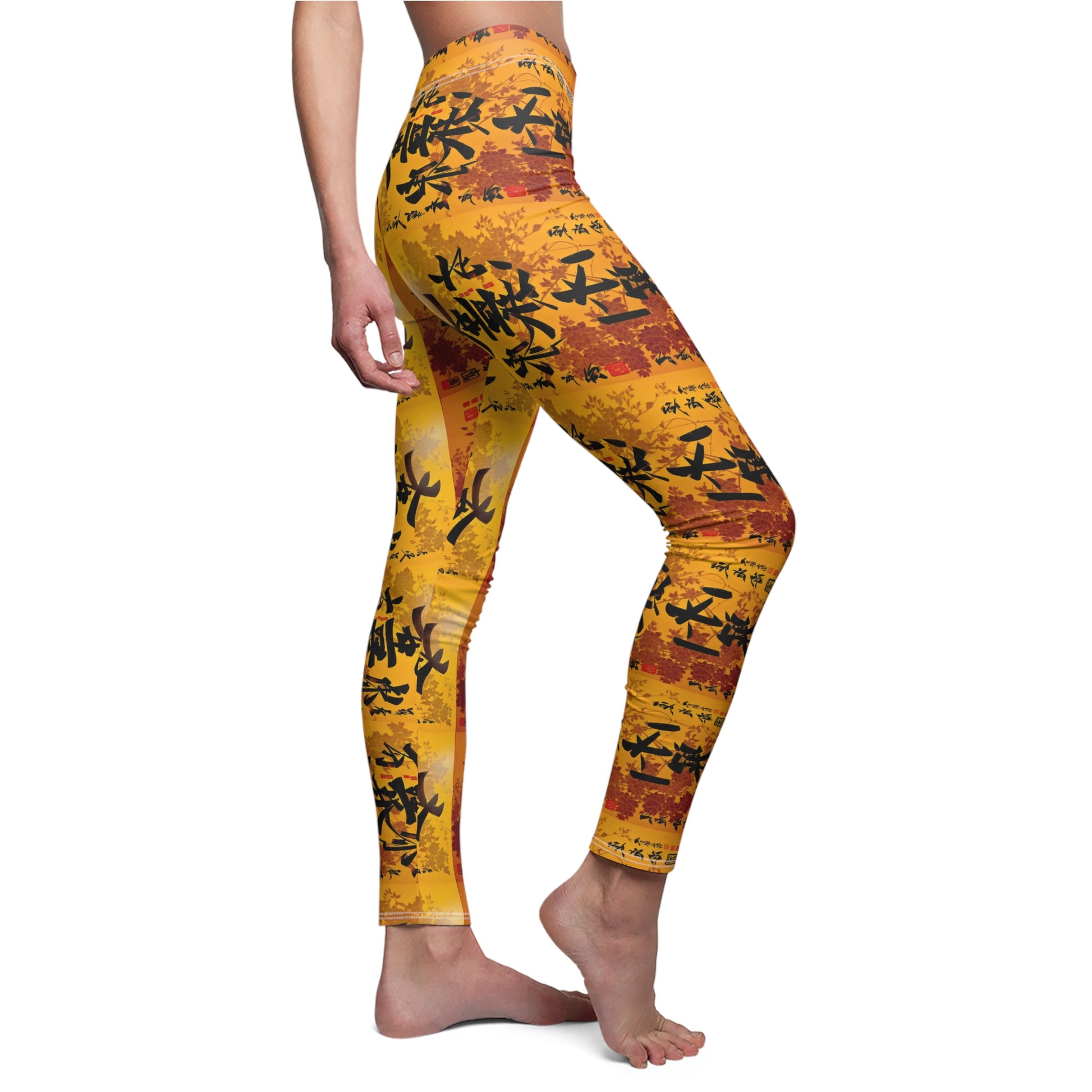 A pair of skinny fit leggings featuring a colorful all-over print, with a gold, black and orange Oriental design, side view, worn by model.
