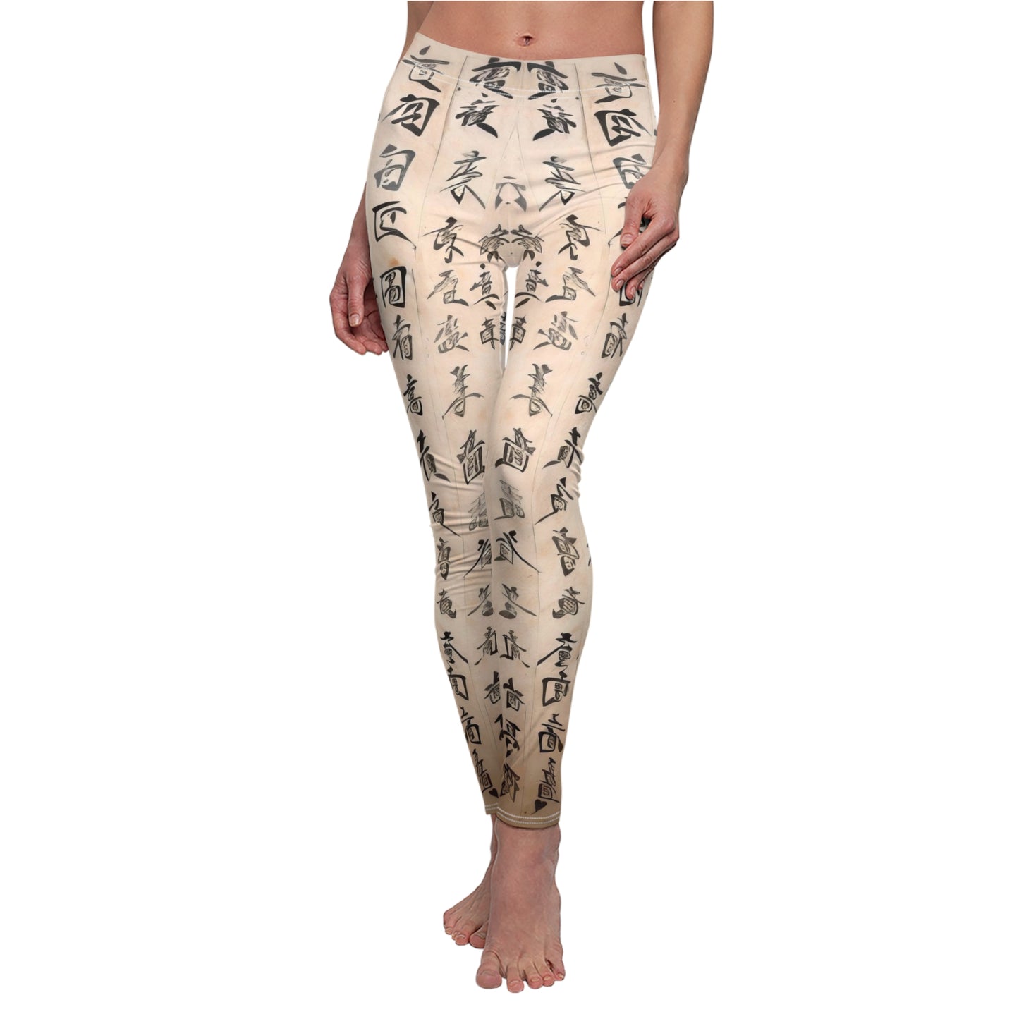A pair of white elastic skinny fit leggings with a crisscross pattern of characters in a light beige color.