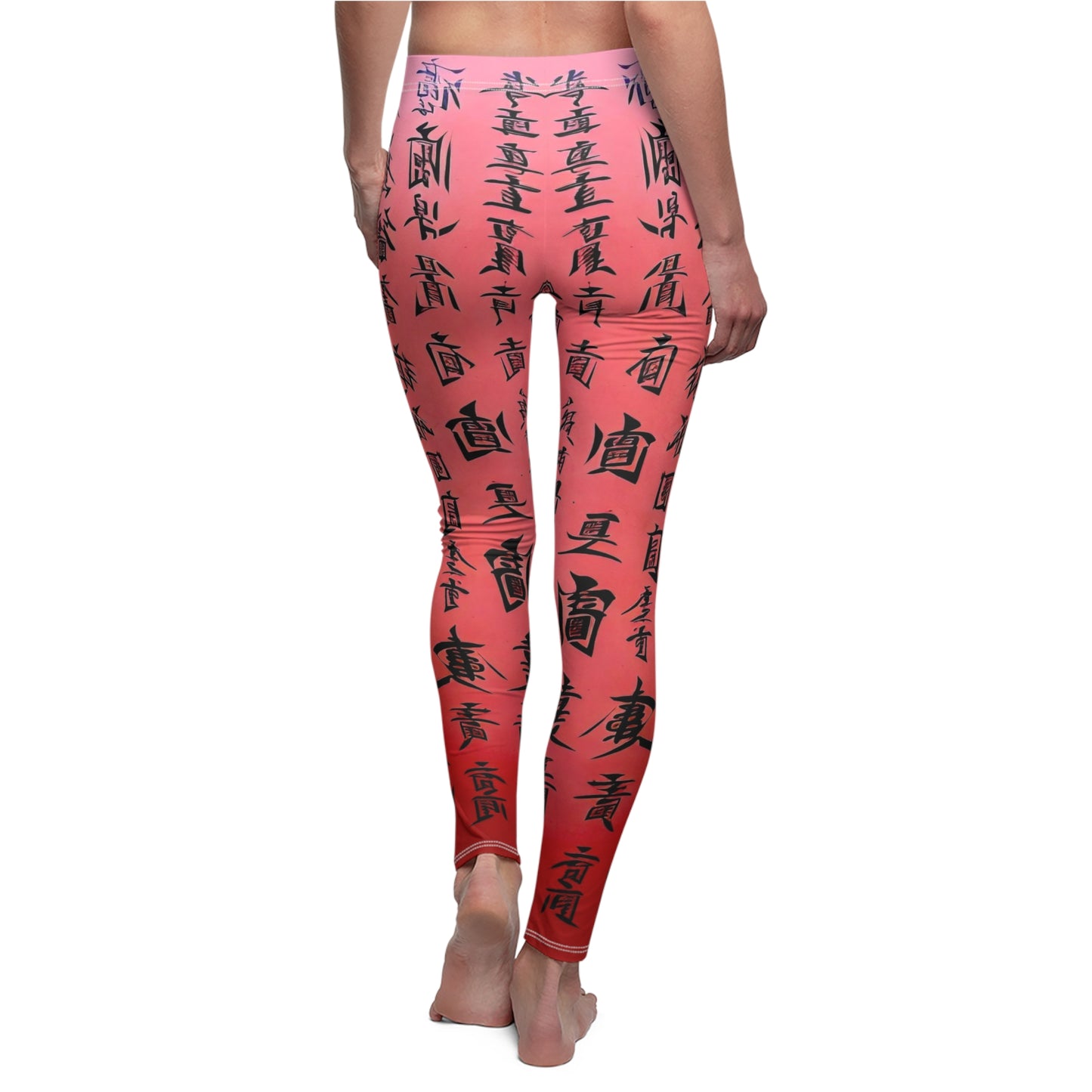 A pair of pink elastic skinny fit leggings with a black all-over print featuring what appears to be Chinese characters.