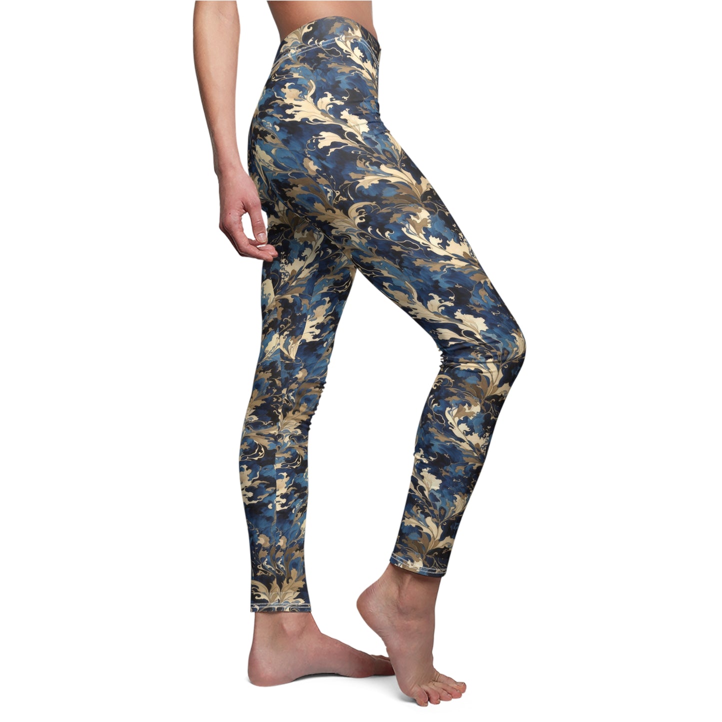 A pair of blue and gold floral print leggings with a skinny fit, elastic waistband, and a high-waisted design.