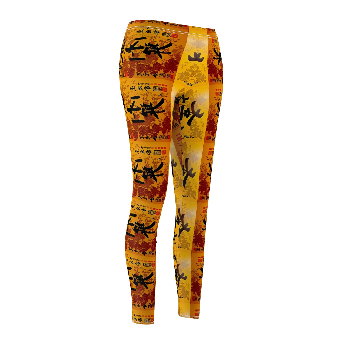 A pair of skinny fit leggings featuring a colorful all-over print, with a gold, black and orange Oriental design, front side view.