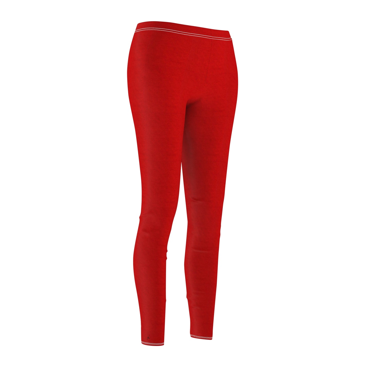 A pair of solid red skinny fit leggings with white thread color at the elastic waistband.