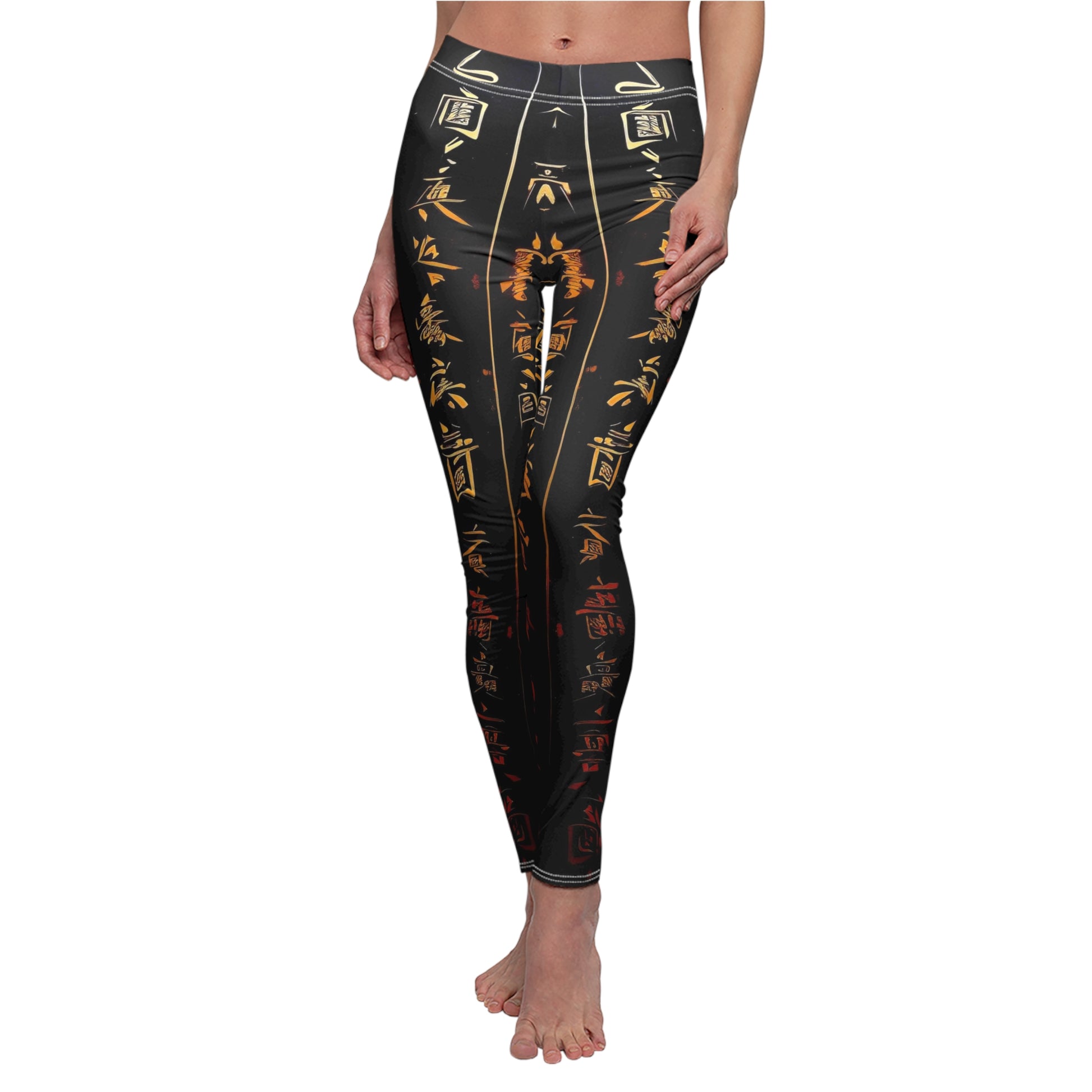 A pair of skinny fit leggings featuring gold and red Chinese lettering on a black background, worn by a model.