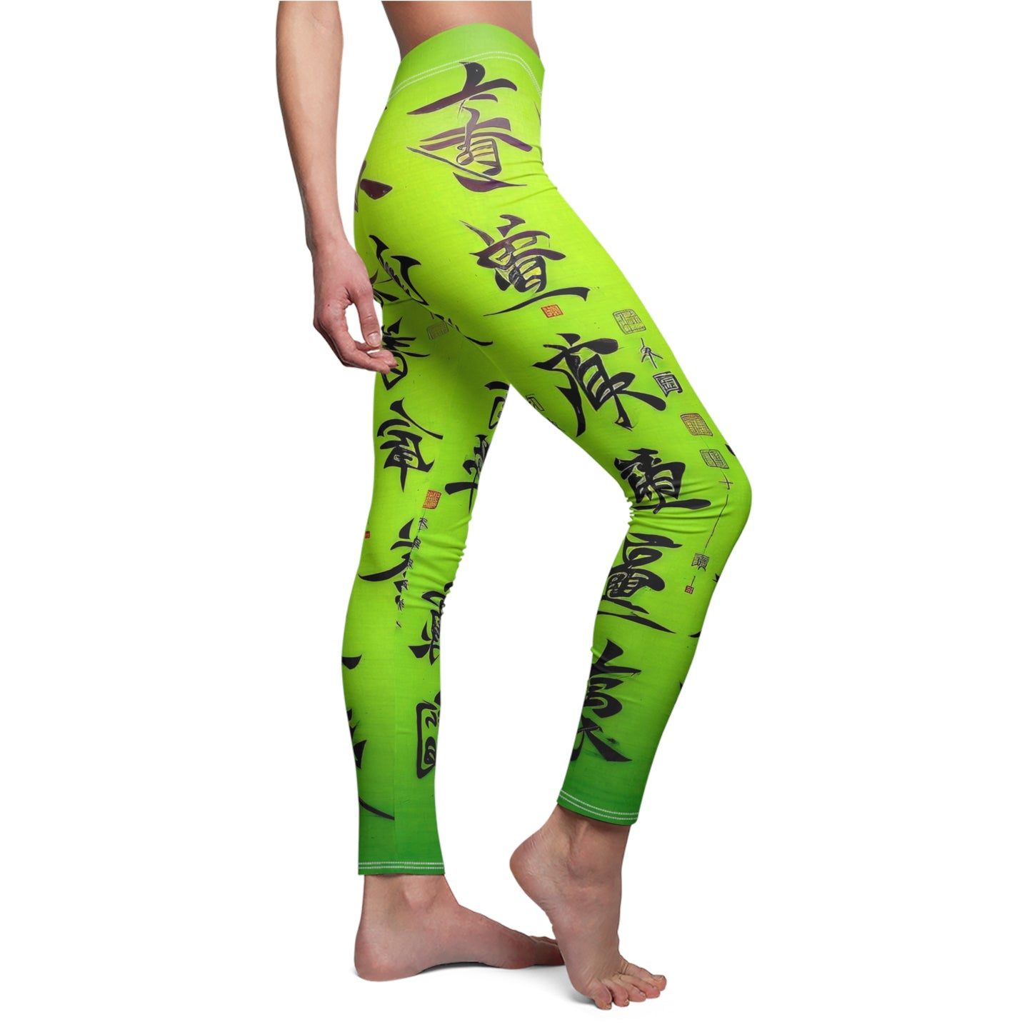 Side view of a model wearing a pair of lime green leggings with a white thread color and a graphic print featuring stylized Chinese lettering in black. 