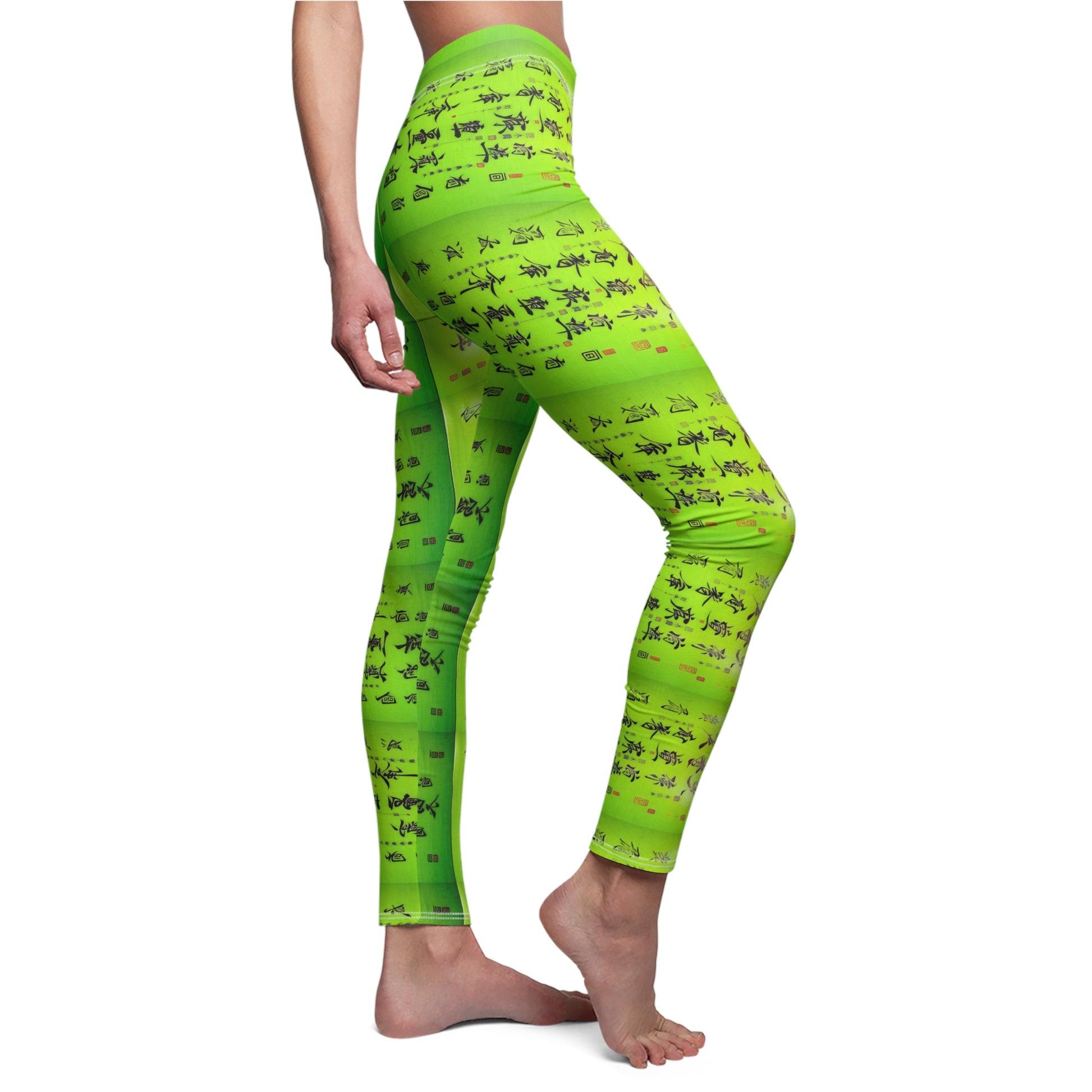 Model wearing a pair of lime green elastic skinny fit leggings with a pattern of Chinese calligraphy.