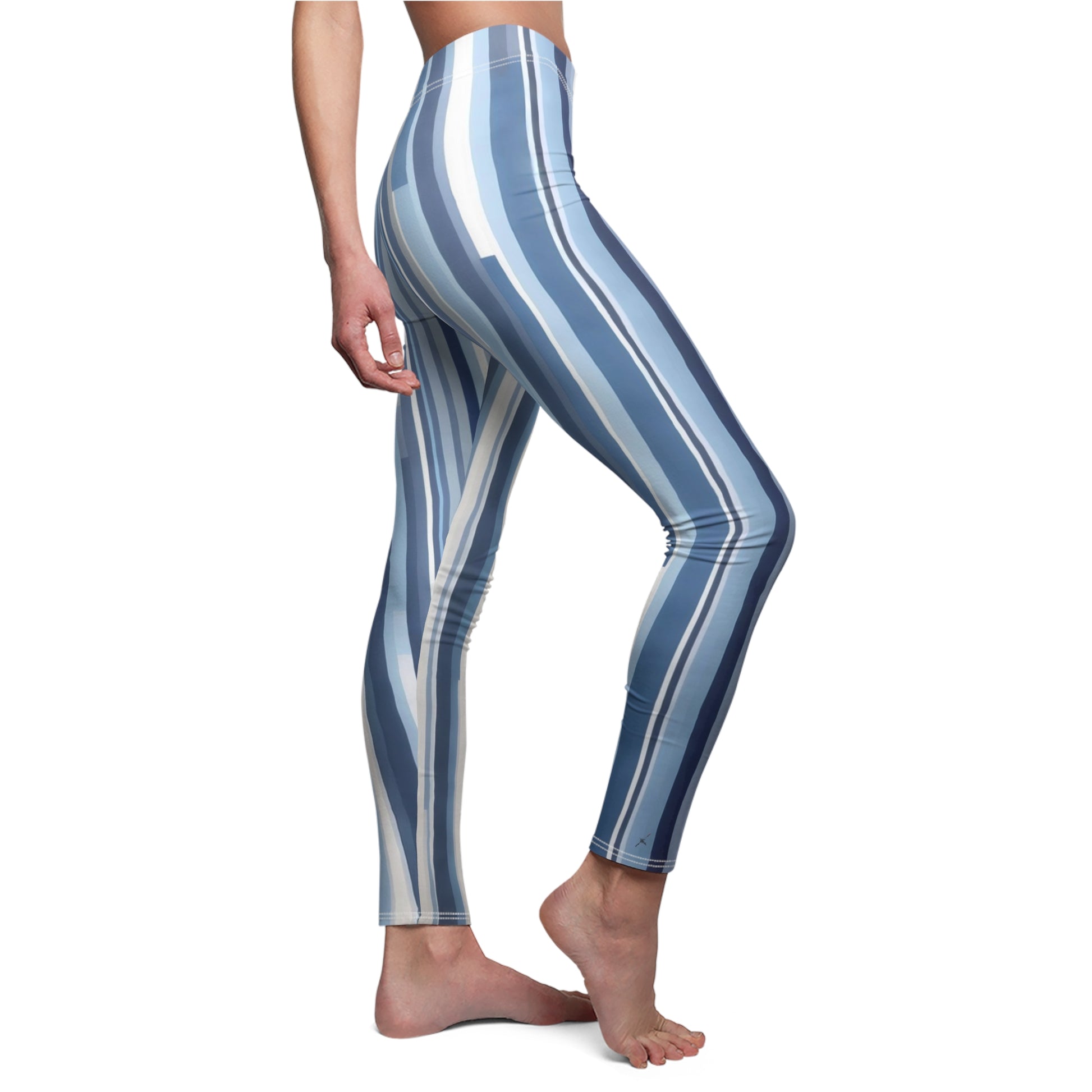 A pair of blue and white striped leggings on a model, front side view.