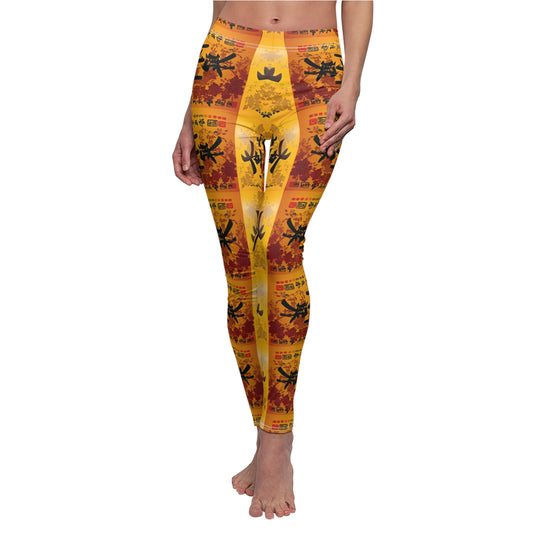 A pair of skinny fit leggings featuring a colorful all-over print, with a gold, black and orange Oriental design.